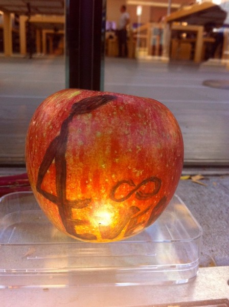 Someone left a real Apple, outside the Apple uptown store in Minneapolis.   [Julio Ojeda-Zapata]