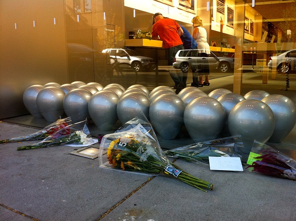 Mourners placed flowers outside Apple's uptown store in Minneapolis.  [Julio Ojeda-Zapata]