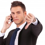 businessman thumbs down angry suit cell phone iPhone businessman thumbs down angry suit cell phone iPhone