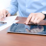 businessman on tablet
