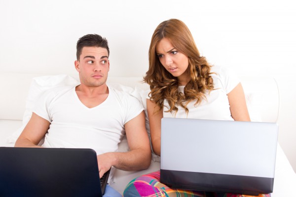 Shocked surprised man woman girlfriend boyfriend laptop