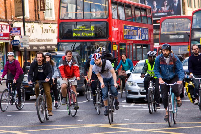 People cycling through London