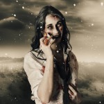 Deadly blizzard of falling snow pouring down on a dead female zombie crying tears of pain