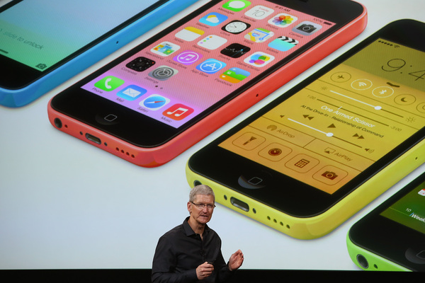 CUPERTINO, CA - SEPTEMBER 10: Apple CEO Tim Cook speaks about the new iPhone during an Apple product announcement at the Apple campus on September 10, 2013 in Cupertino, California. The company launched two new iPhone models that will run iOS 7. The 5C is made from a hard-coated polycarbonate and comes in five colors. The 5S comes in three colors, features a fingerprint sensor, has an upgraded camera, and contains an A7 chip. (Photo by Justin Sullivan/Getty Images)