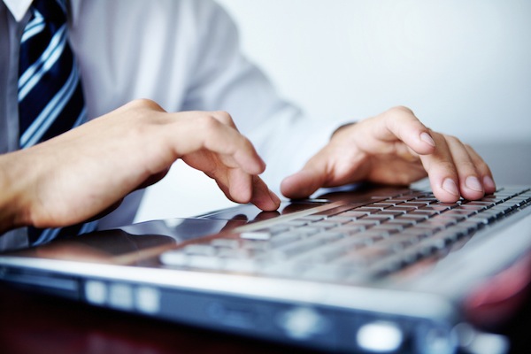 laptop keyboard hand fingers tie businessman IT