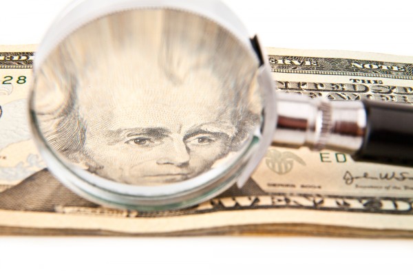 money cash magnifying glass
