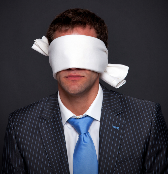 Blindfolded businessman