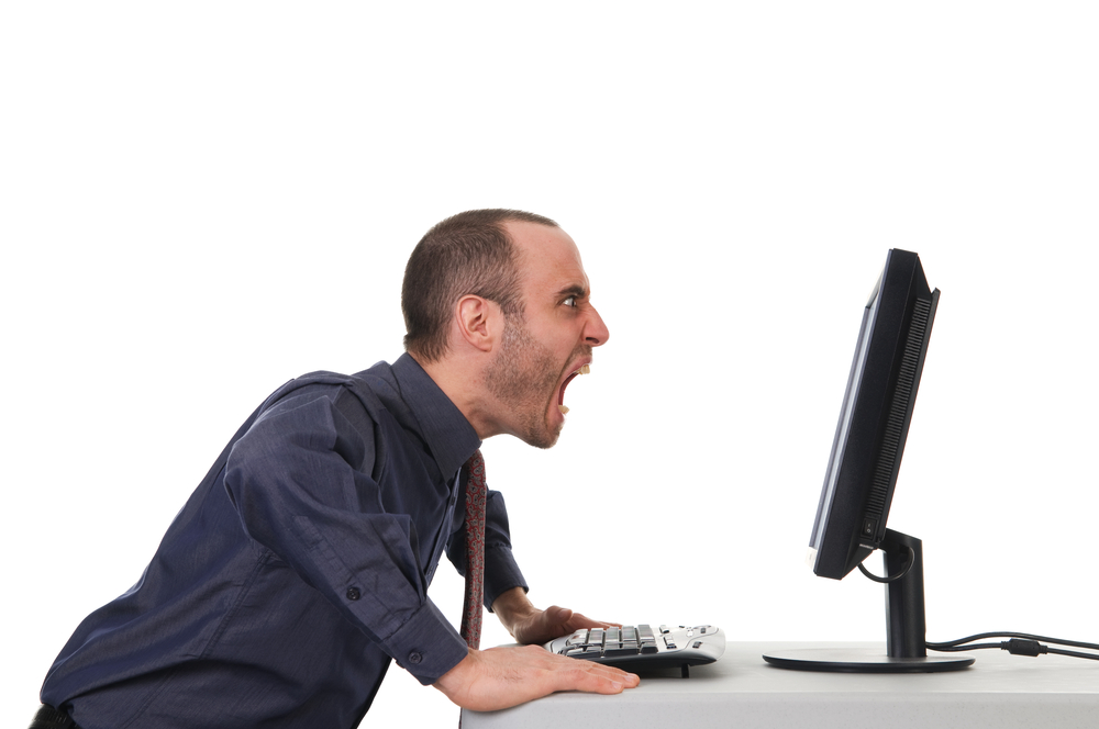 man yelling at computer