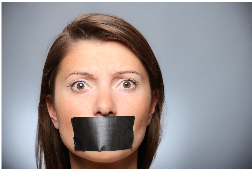 girl with mouth taped