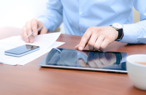 businessman on tablet