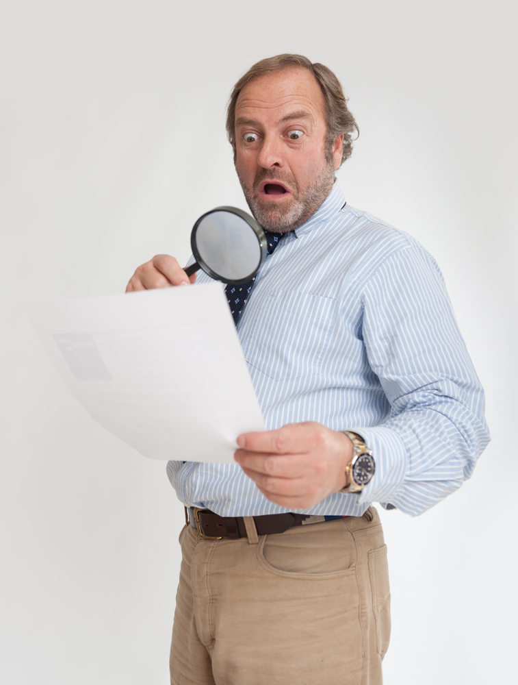 man with magnifying glass