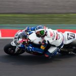 Honda TT Legends rider John McGuinness leaned on superbike on track