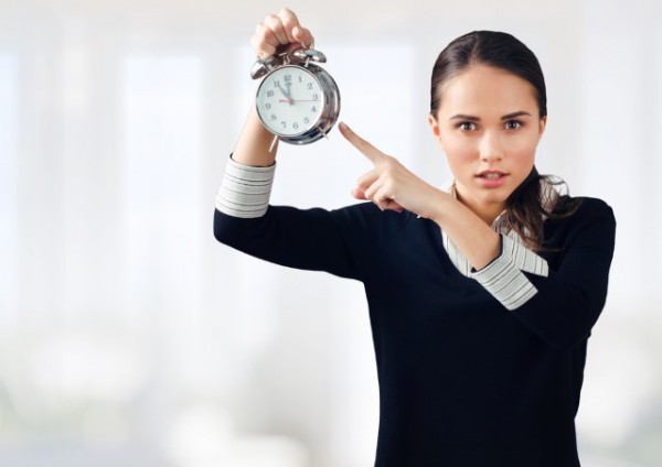 woman_pointing_at_clock