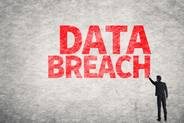Data breach wall writing man