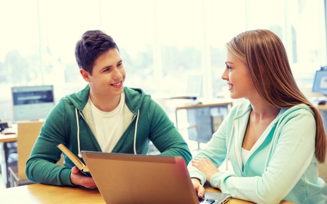 boy girl laptop students