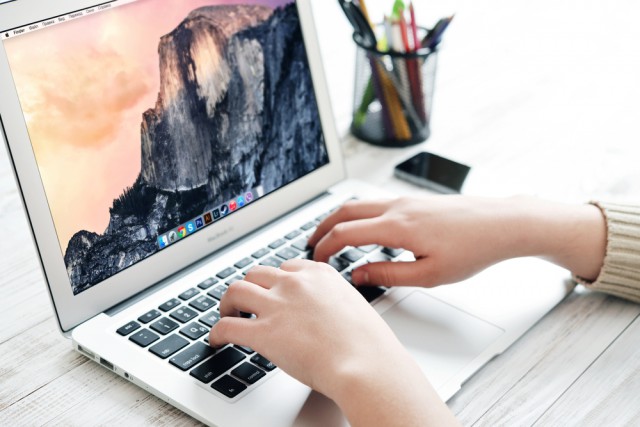 Apple MacBook Air laptop hands keyboard office desk