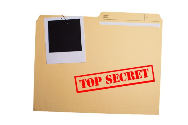 classified file spy folder on desk