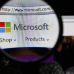 Microsoft logo under magnifying glass