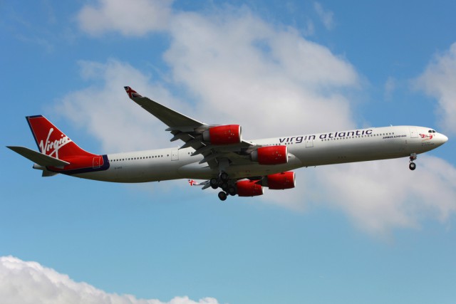 London Heathrow, United Kingdom - May 25, 2013: A Virgin Atlantic Airbus A340-600 with the registration G-VFIT on approach to London Heathrow Airport (LHR) in the United Kingdom. Virgin Atlantic Airways is a British airline with 43 planes and 5.5 million passengers in 2012.