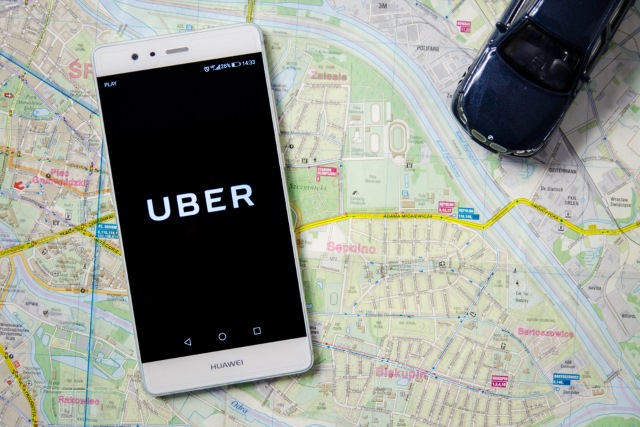 Uber on a phone sitting on a map