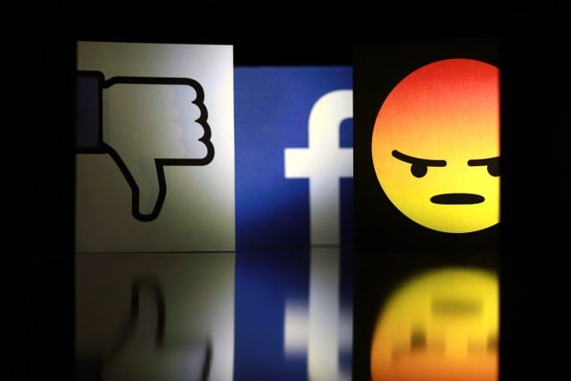 Facebook logo with angry icon and thumbs down