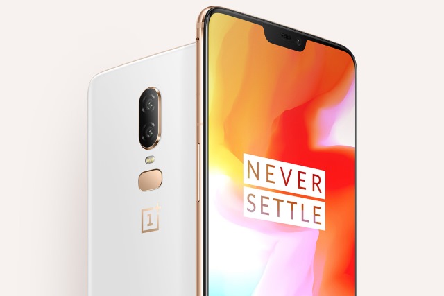 OnePlus 6 with Never Settle slogan