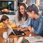 Parent and children at computer