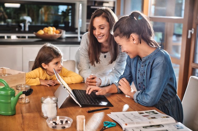 Parent and children at computer