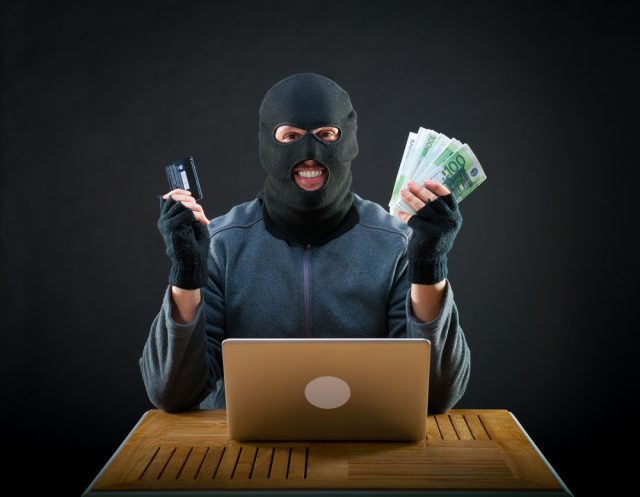 Cybercriminal with cash