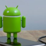 Android figure on smartphone