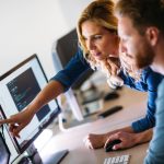 developers looking at screen pointing