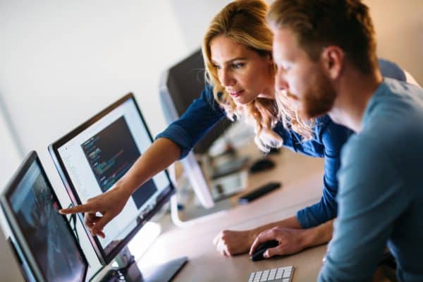 developers looking at screen pointing