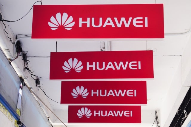 Four Huawei signs