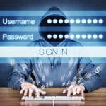 Hacker typing username and password