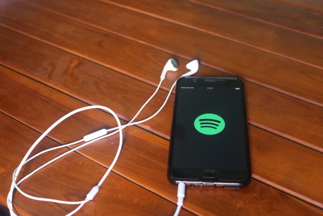 Spotify on phone with earphones