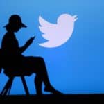 Twitter logo and a woman in silhouette