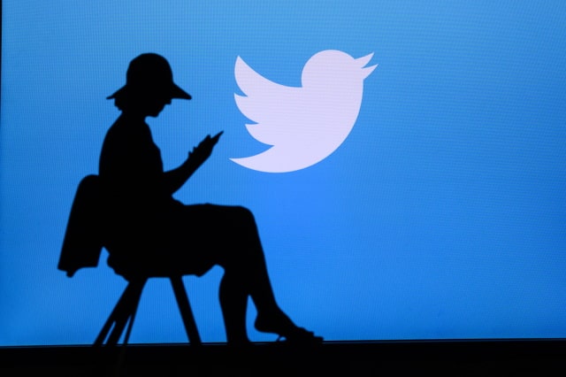 Twitter logo and a woman in silhouette