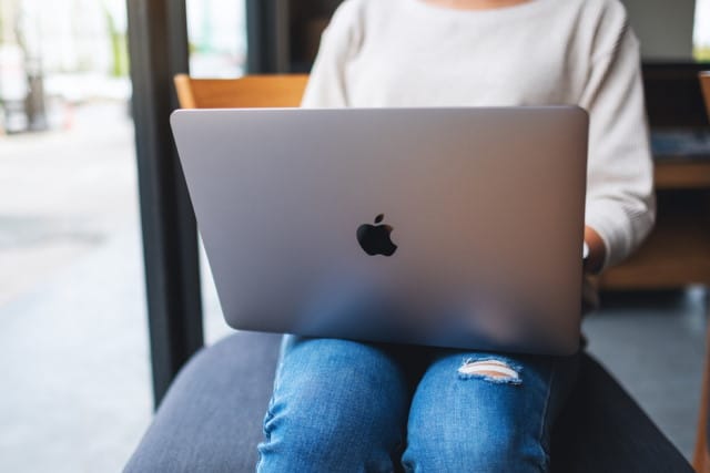 Woman using MacBook Pro