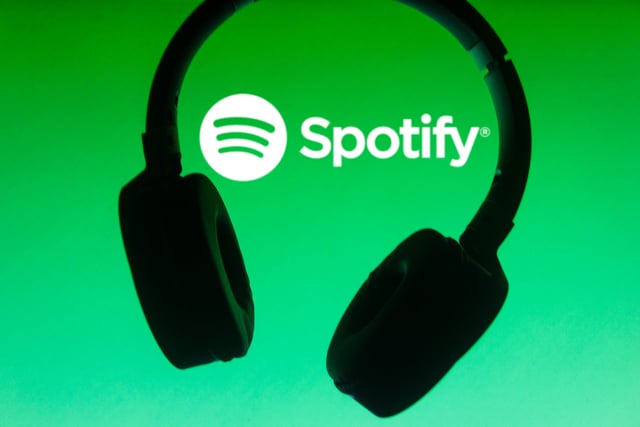 Headphones on Spotify logo