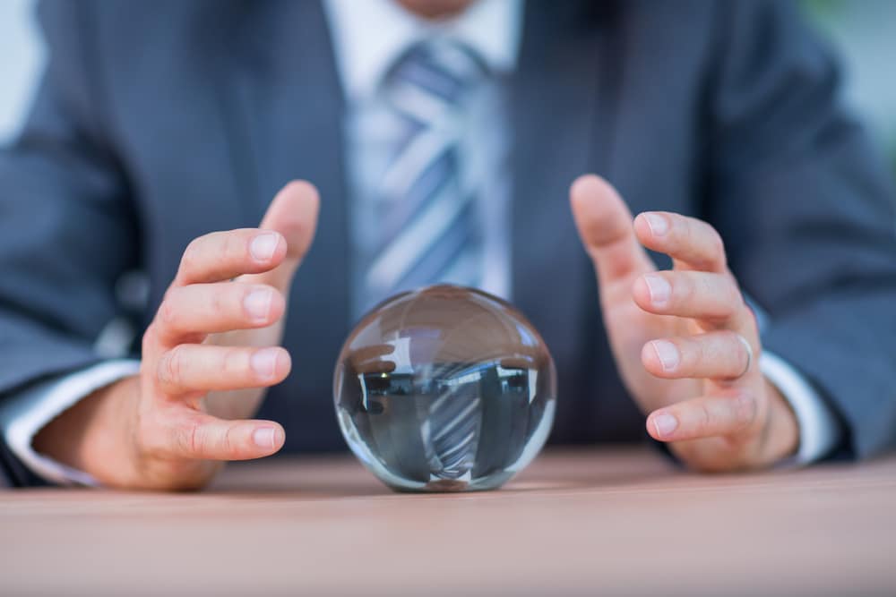 Businessman forecasting crystal ball