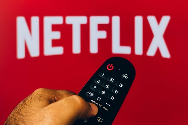 Netflix logo with remote