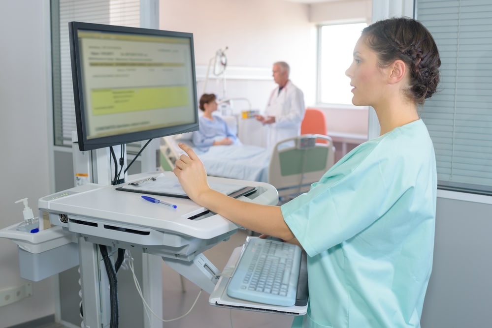 Nurse using computer and nurse