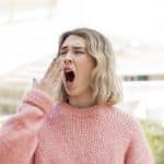 Bored woman yawning