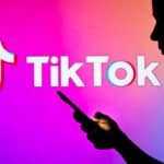 TikTok logo with user silhouetted in foreground