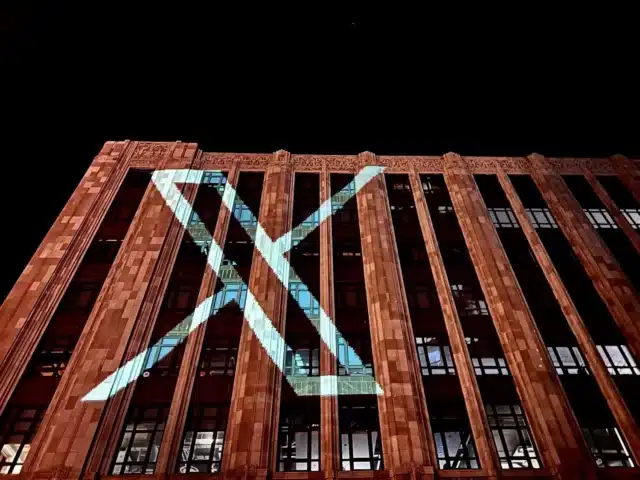 Twitter X logo projected onto building
