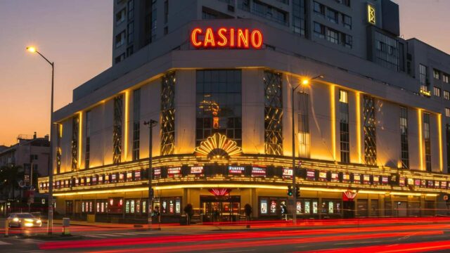 Illuminated casino at dusk.