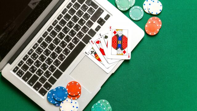 A laptop on a poker table