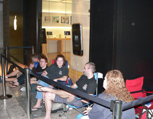 Four employees of a local Indianapolis video editing studio stake out early positions in line to purchase iPhones for their whole company.