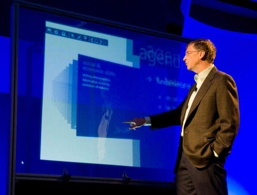 At a CEO summit in Redmond on Wednesday, Microsoft Chairman Bill Gates demonstrates making selections on a prototype 'Touch Wall,' though here - curiously - he seems to be pointing to nothing.  (Courtesy Microsoft)