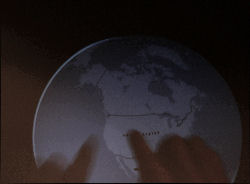An example multitouch application where the user's hands 'handle' an on-screen globe.